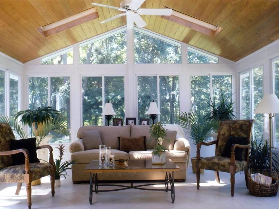 Newly built sunroom in Oak Island, NC, home featuring floor-to-ceiling windows.